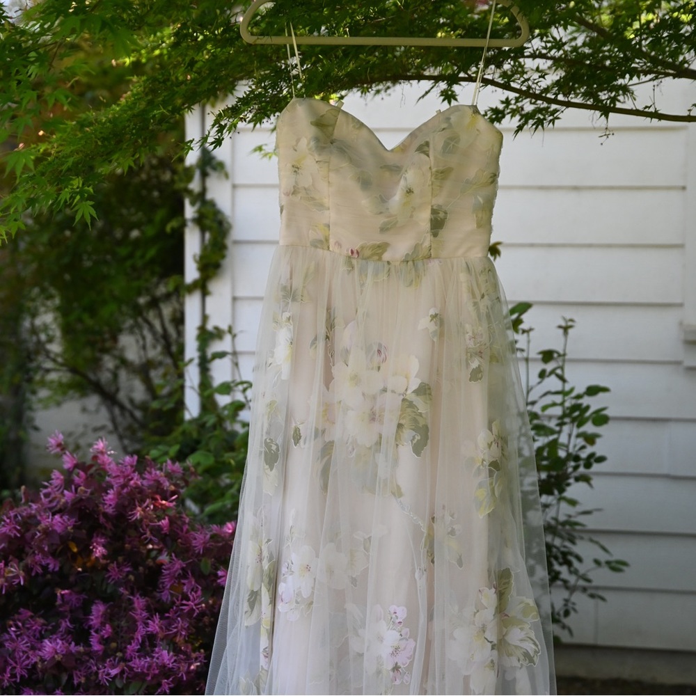 Prom/Formal Dress Size Medium. New with tags floral strapless gown.